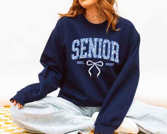 Senior 2027 floral bow sweatshirt featuring blue coquette ribbon design for Class of 2027 students