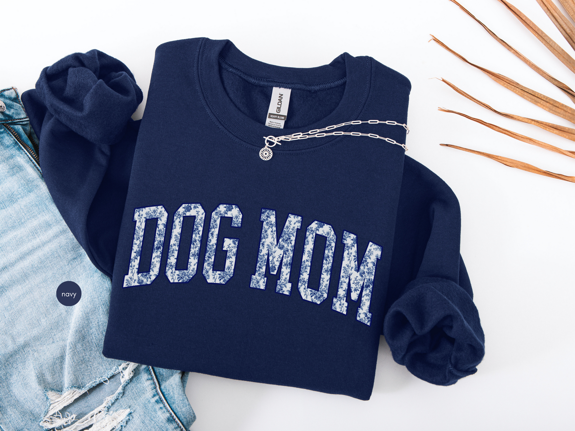 Dog Mom navy varsity sweatshirt with blue toile pattern lettering styled with jeans and necklace