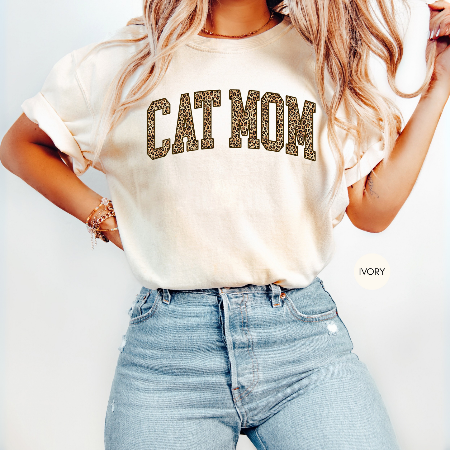 Ivory Cat Mom t-shirt with leopard animal print varsity lettering styled with light blue jeans.