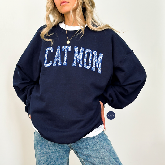Cat Mom floral varsity sweatshirt in navy blue cozy crewneck for cat lovers styled on model