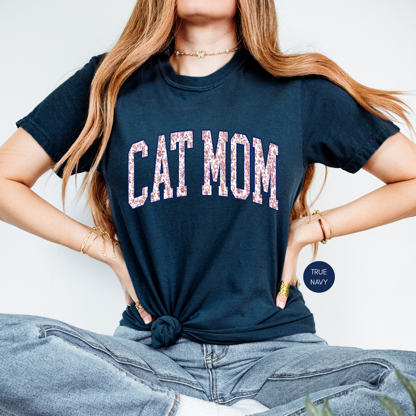 True navy Cat Mom t-shirt with floral varsity lettering styled with light wash jeans.