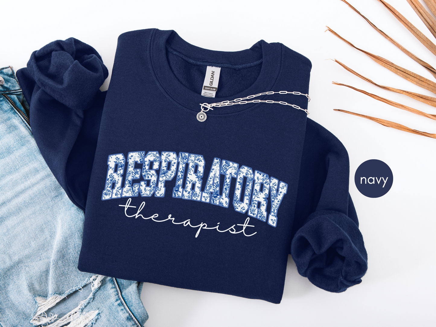 Respiratory therapist sweatshirt with blue toile design on navy crewneck
