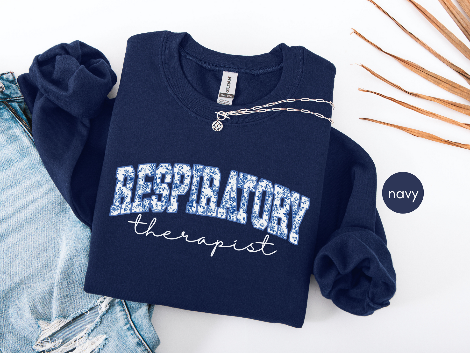 Respiratory therapist sweatshirt with blue toile design on navy crewneck
