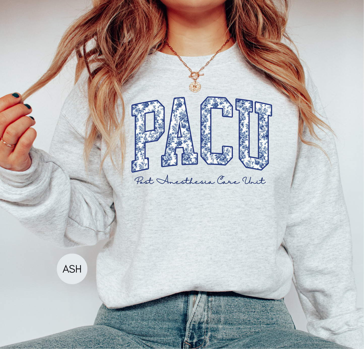 Close-up of PACU sweatshirt blue toile lettering
