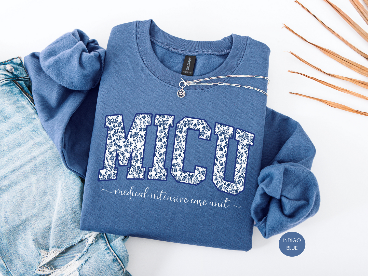 MICU blue toile sweatshirt with Medical Intensive Care Unit lettering displayed in a flat lay nurse outfit style