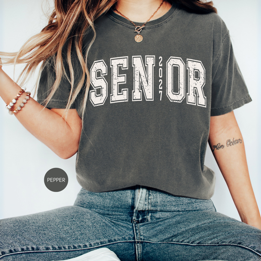 Senior 2027 Comfort Colors pepper shirt featuring vintage varsity lettering for Class of 2027 graduation