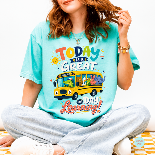 Chalky Mint Comfort Colors teacher shirt featuring a colorful school bus and the phrase "Today Is a Great Day for Learning."